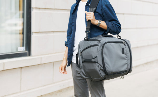 A person wearing the Techonaut 45 with a shoulder strap.